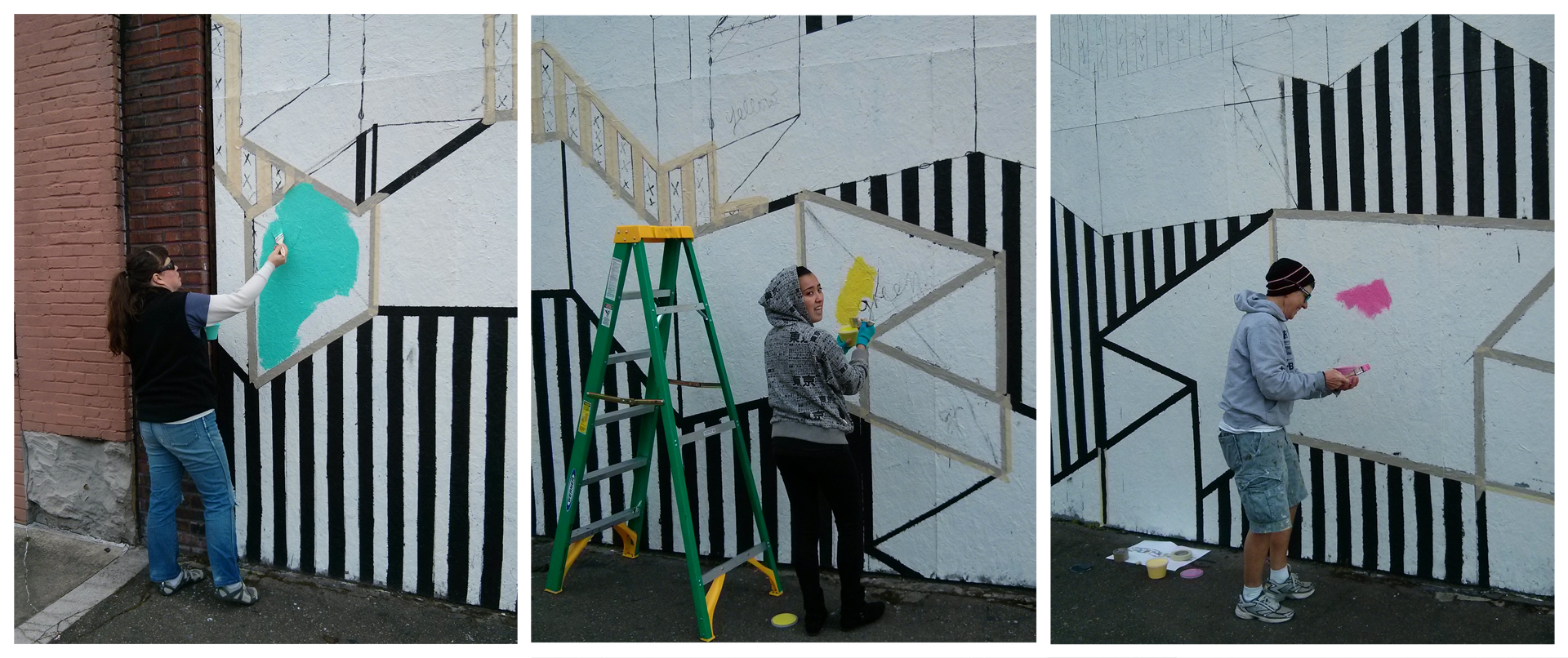 Community volunteers (L to R): Jennifer English, Elysa Saito and Sur Holland fill in color on Surma's mural.